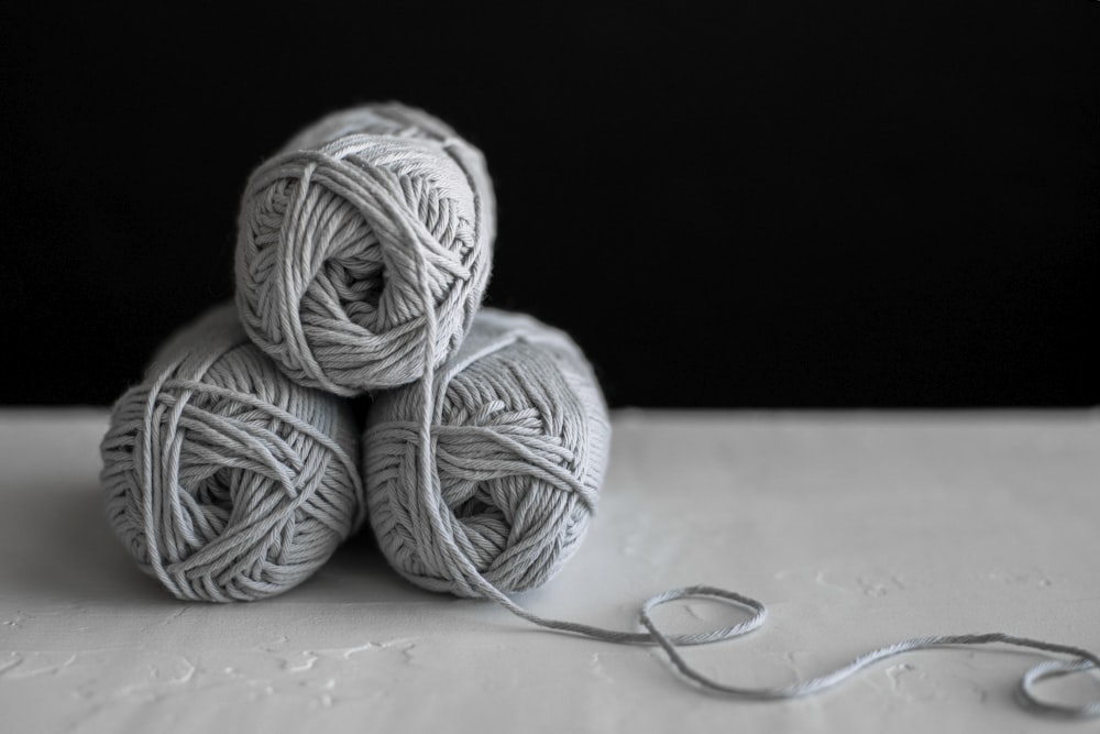 three yarns on table