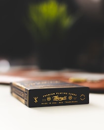 Theoryll playing cards box on white board