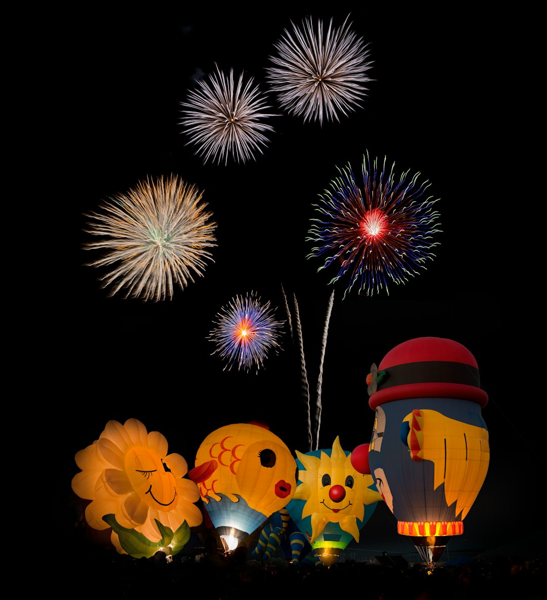 hot air balloons and fireworks display