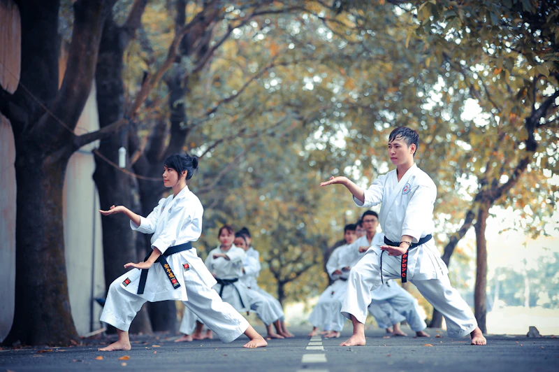 A group of children practising punches in a kids martial arts class