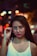 woman holding eyeglasses