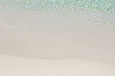 Pristine white sandy beach at Donald Duck Bay with gentle waves