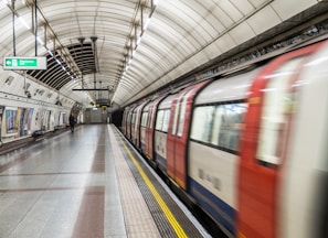 running red and white train in the subway