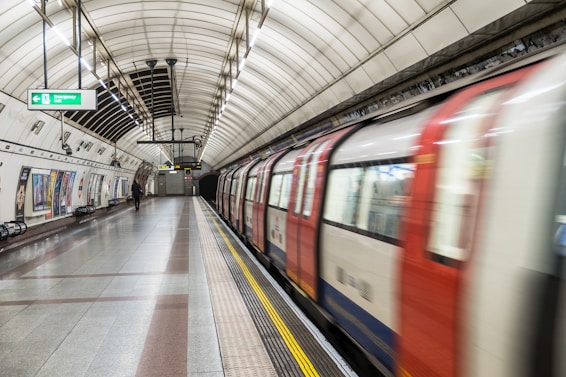 running red and white train in the subway