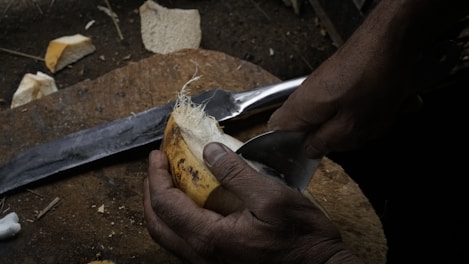 A sturdy paring knife with a comfortable handle resting beside freshly cut fruit.