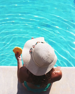 woman sitting beside swimming pool, cuh2o, eco friendly,