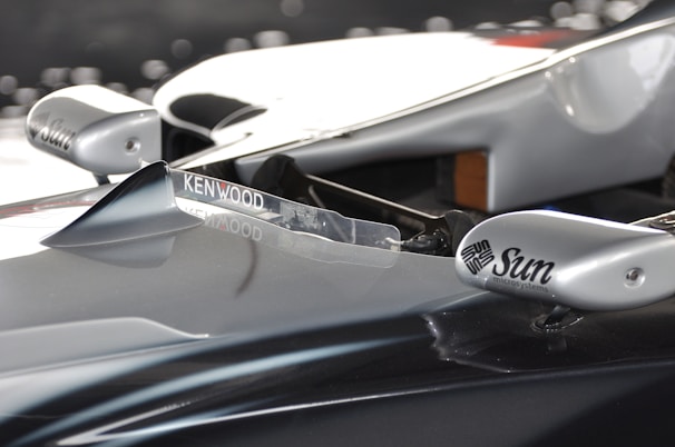 Close-up of Jorge Solís's racing helmet with sponsor logos shining under the sun.