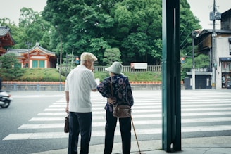 man and woman standing in front of pedestrian line