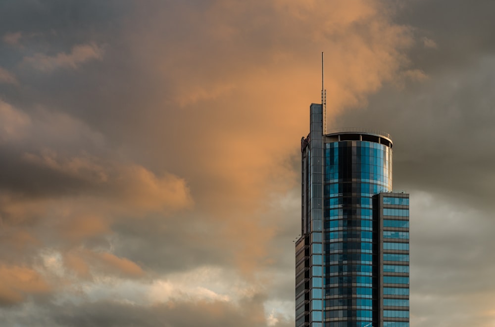 blue concrete building during cloudy sky