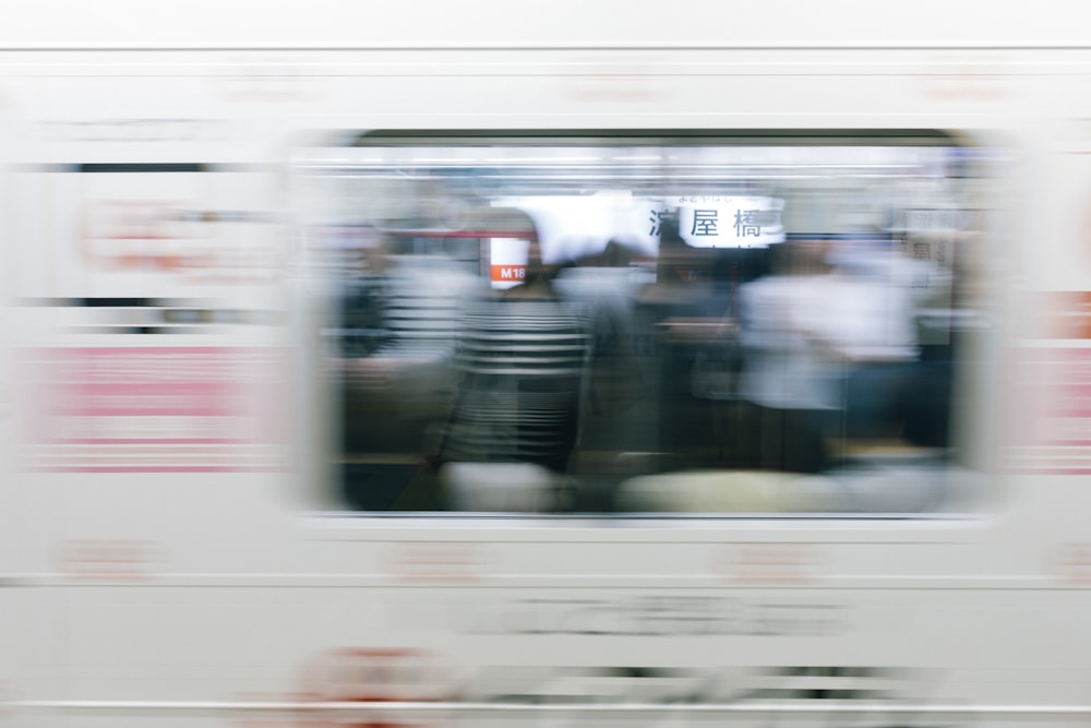 a blurry photo of a subway train passing by