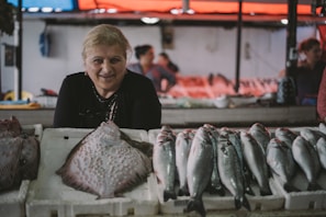 woman standing in front of fish display