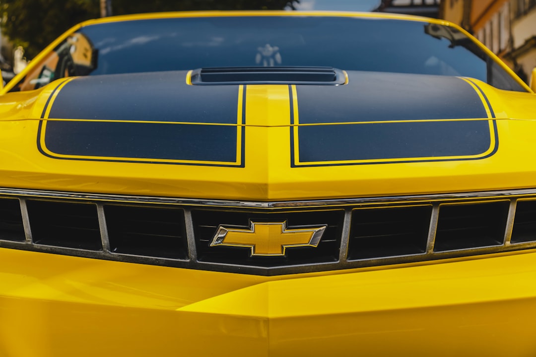 yellow and black Chevrolet sports car hood