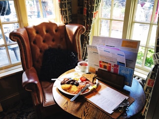Table set with Irish breakfast dishes and fresh coffee in a warmly lit room