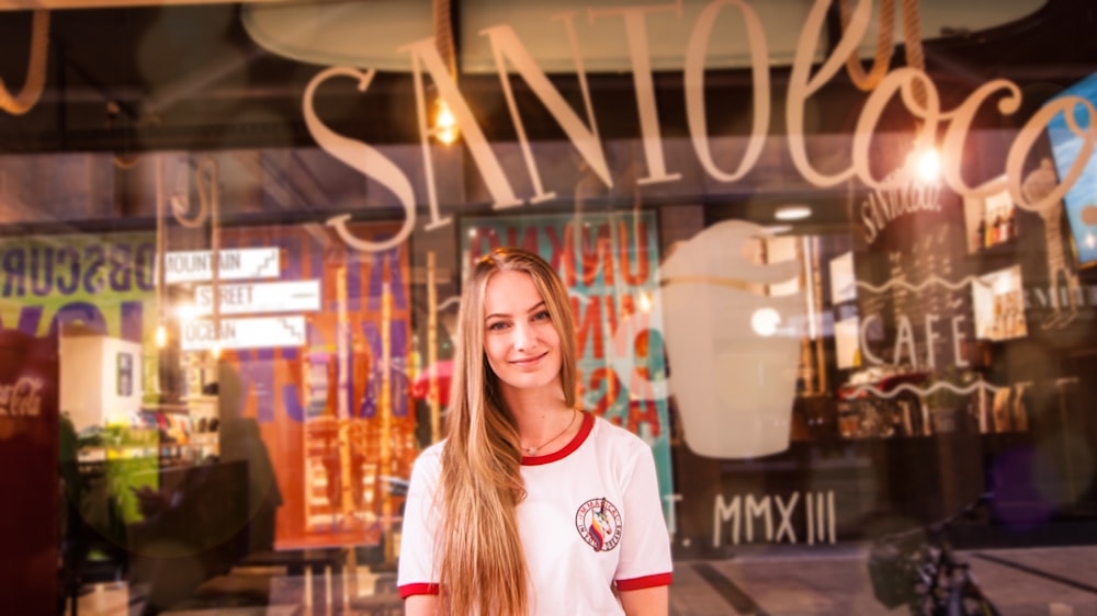 woman standing in front of clear display window