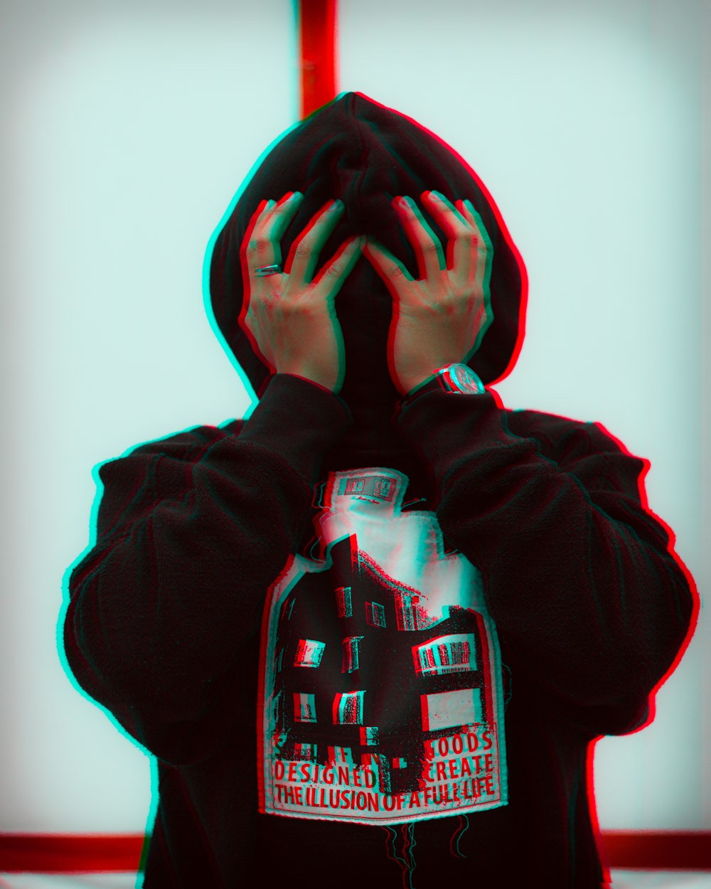 person wearing black pullover hoodie