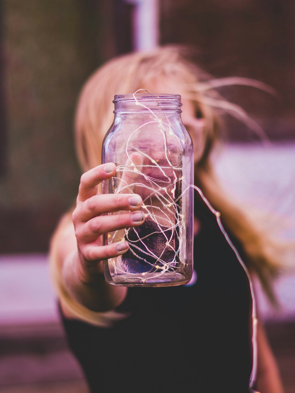 selective focus photography of glass jar