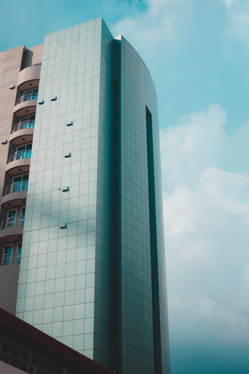 glass and beige building during daytime