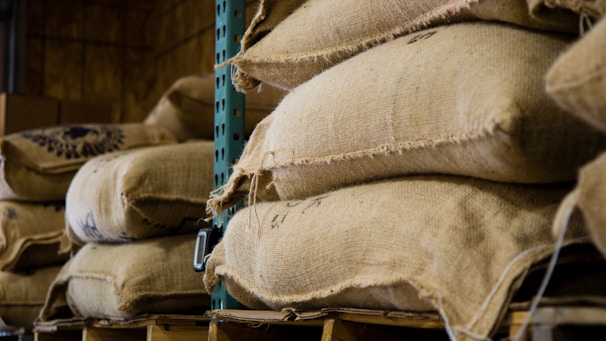 Stacks of nutrient-rich fertilizer bags neatly arranged in a warehouse