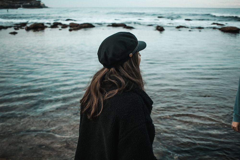 woman standing on shallow water