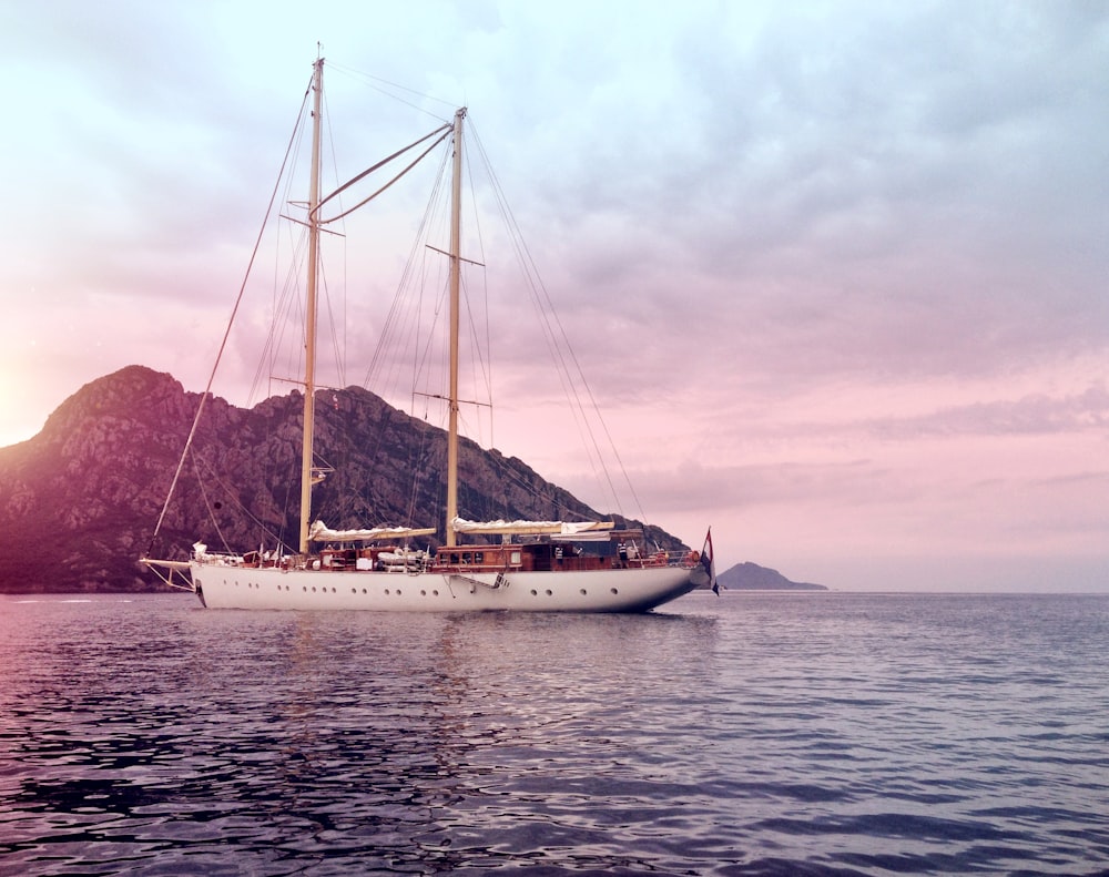 white and brown ship on water