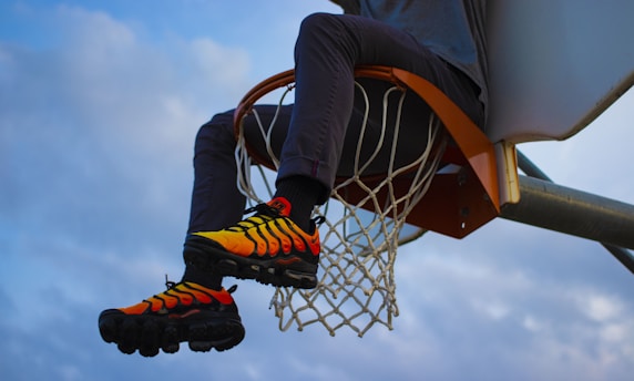 a basketball player dunking the ball into the hoop