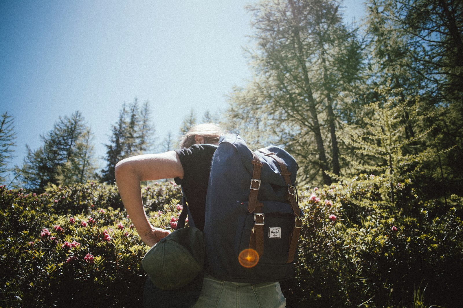 Nikon D7100 + Nikon AF-S DX Nikkor 18-55mm F3.5-5.6G VR sample photo. Woman carrying bucket backpack photography