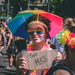 person holding Free Hugs signage