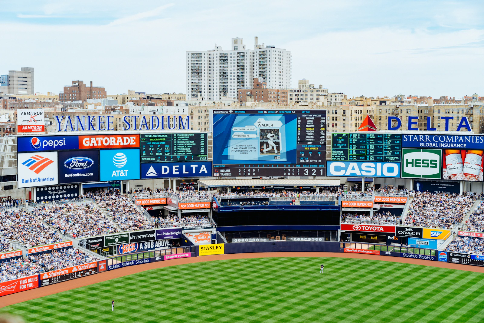 Fans watching a baseball game at Yankee Stadium