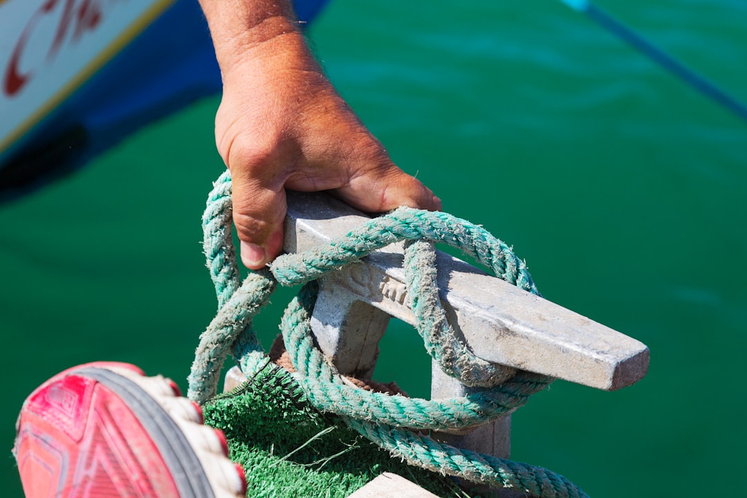 person holding green rope