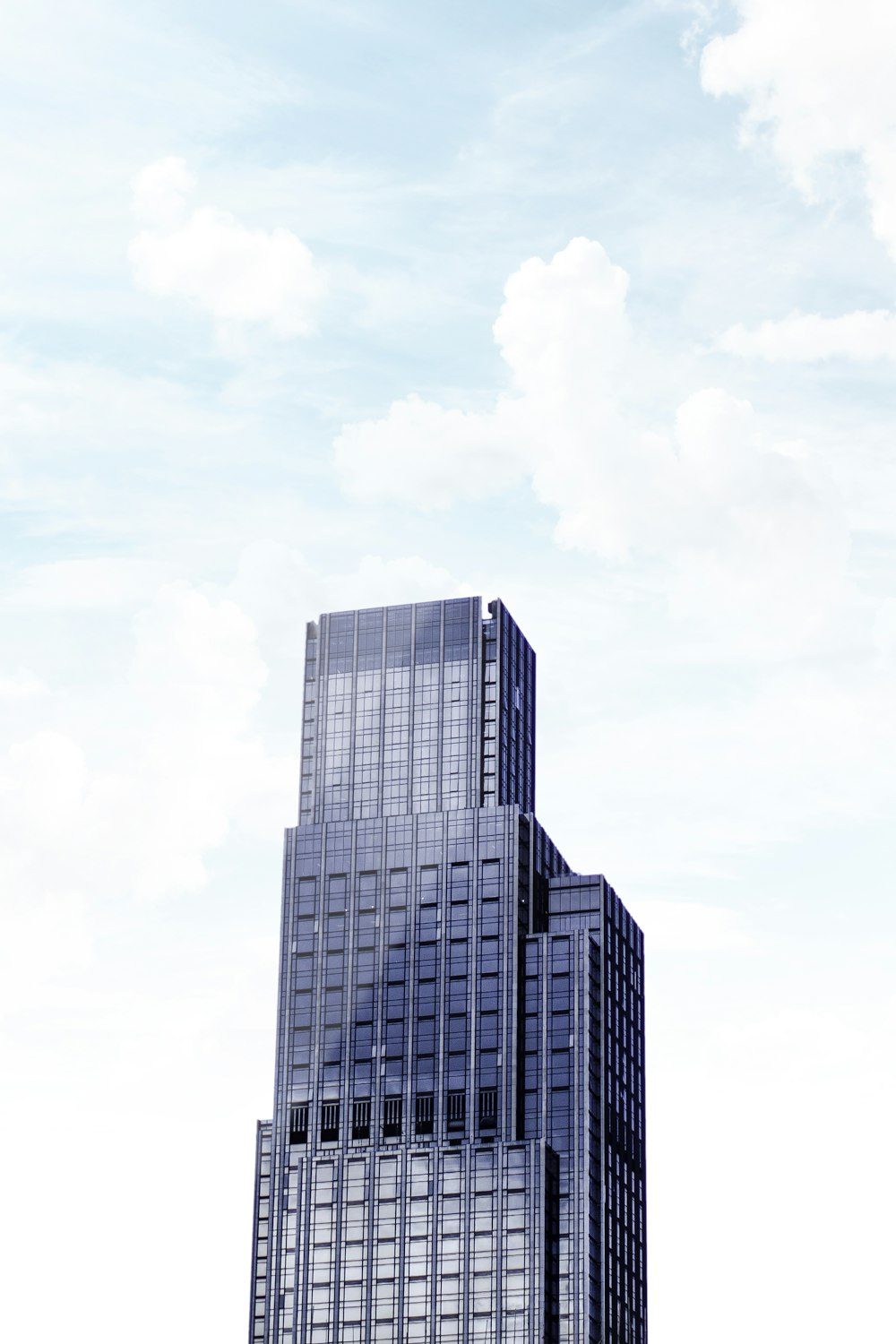 a very tall building with a sky background