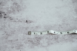 white measuring tape on white surface