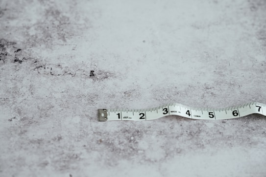 white measuring tape on white surface
