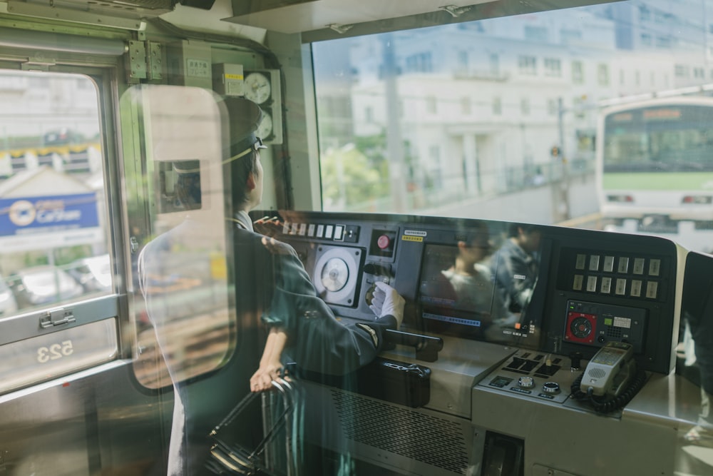 man inside train's control panel booth