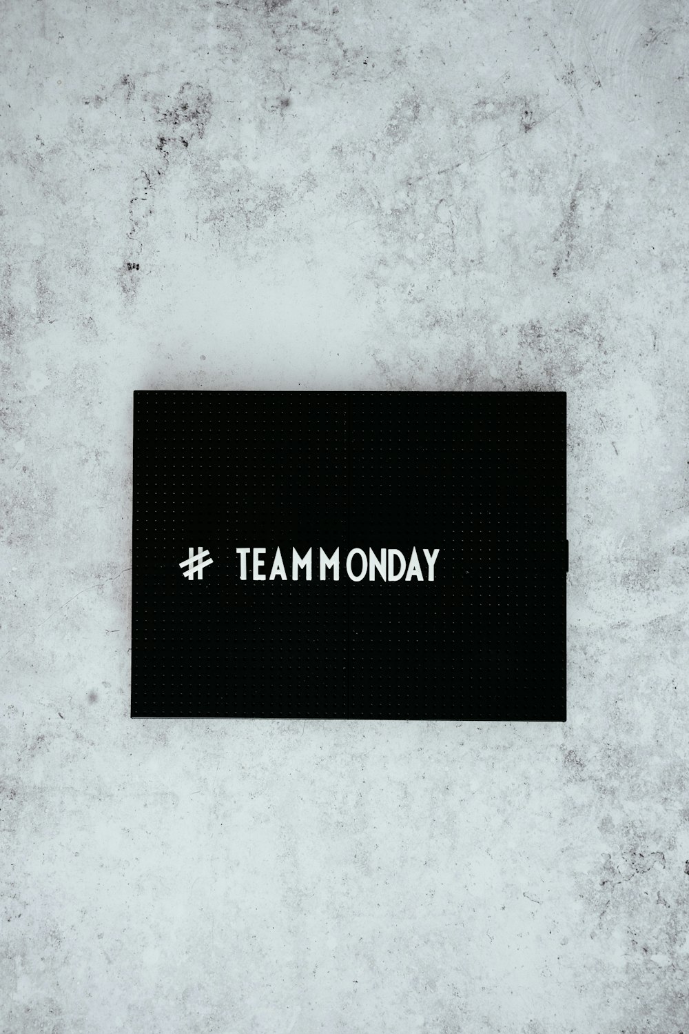 #team monday text overlay on black background