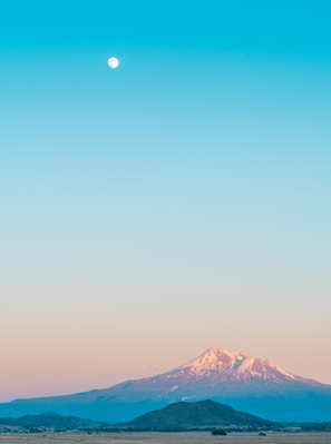 brown mountain under moon