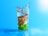 A close-up of a glass filled with clear alkaline water, surrounded by fresh fruits.