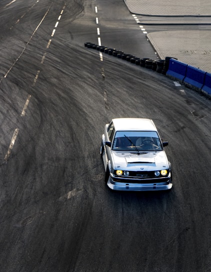 white car on gray asphalt road