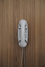 gray home phone on wall