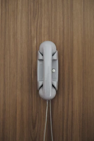 gray home phone on wall