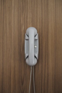 gray home phone on wall