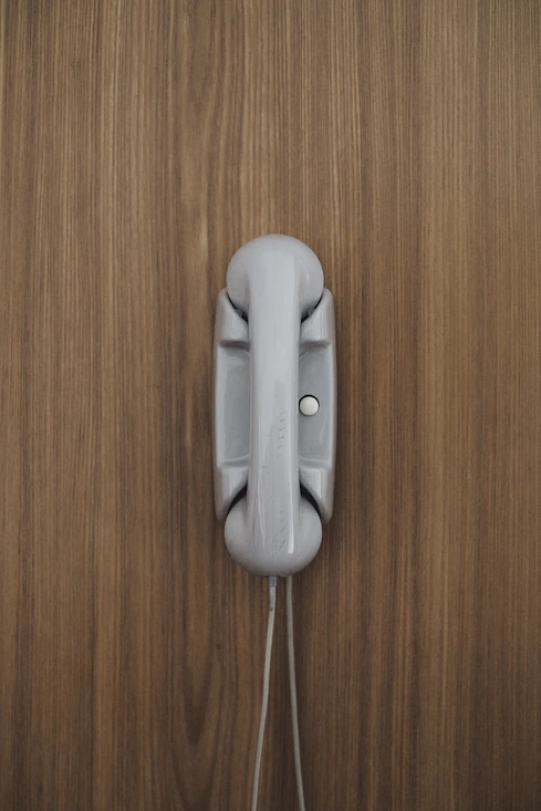 gray home phone on wall
