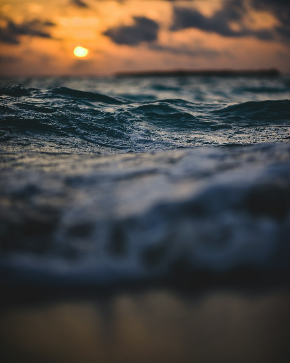 time lapse photography of body of water under golden hour