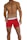 A muscular male torso is displayed, wearing bright red boxer briefs with a white waistband. The waistline of the briefs has a brand logo visible on it. The skin tone is tanned and the individual is posed in a confident stance.