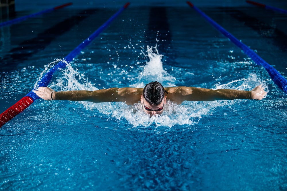 man doing butterfly stroke