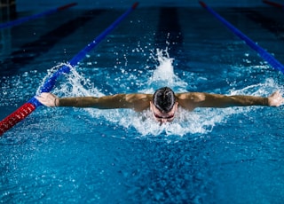 man doing butterfly stroke