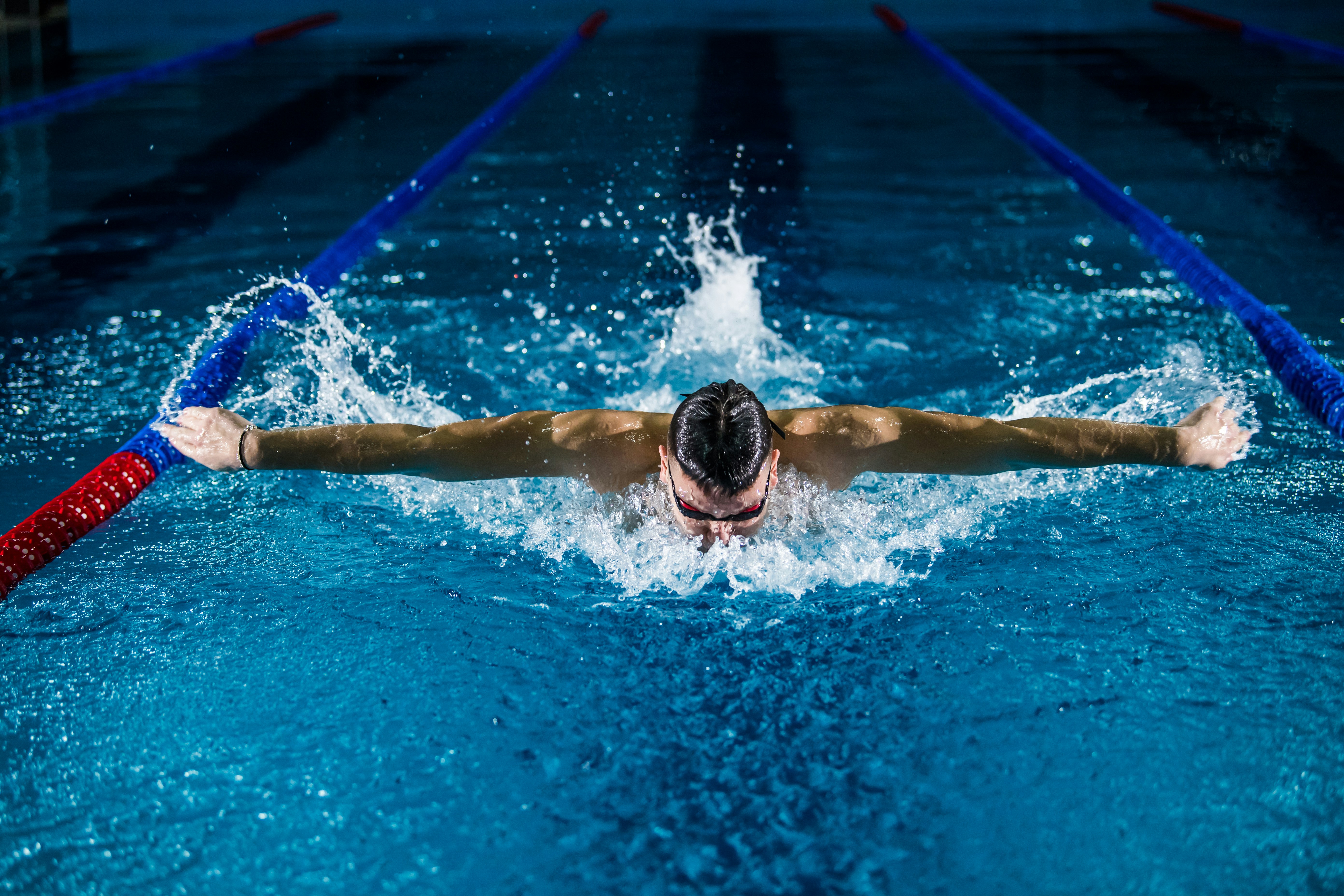 man doing butterfly stroke