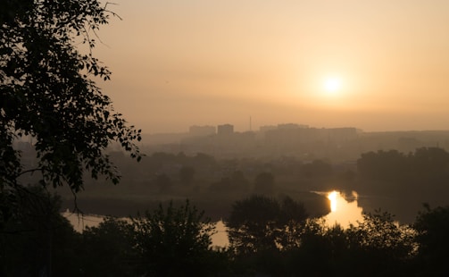 A serene urban landscape bathed in soft morning light, emphasizing calm and stillness.
