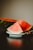 watermelon slice on white ceramic plate
