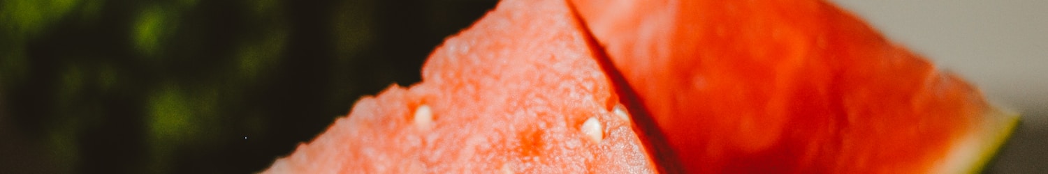 watermelon slice on white ceramic plate