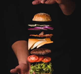 timelapse photo of man holding burger